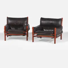 Arne Norell, Pair of rosewood 'Kontiki' armchairs, c.1969, each upholstered in black leather