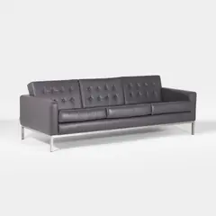 Robin Day, Three-seater 'button' sofa, supported on a chrome frame