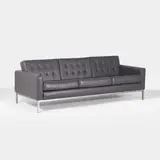 Robin Day, Three-seater 'button' sofa, supported on a chrome frame