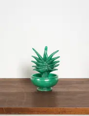 Vase et plante succulente n. 2470 by Napoleone Martinuzzi, A '2470' vase and succulent plant in pulegoso tinted glass designed by Napoleone Martinuzzi and executed by Venini & C, offered Apr 2025