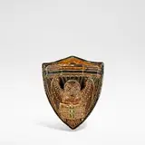 Robert Wallace Martin, for Martin Brothers, 1878, Glazed earthenware, modelled as an owl holding a book, the backing plate modelled as a shield