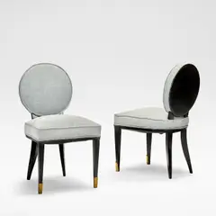 Jean Pascaud, Set of two chairs, circa 1930, Ebonised wood, blue upholstery, gilt brass caps
