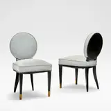 Jean Pascaud, Set of two chairs, circa 1930, Ebonised wood, blue upholstery, gilt brass caps