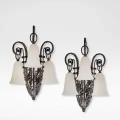 Pair of fer forgé appliques by Edgar Brandt, circa 1925, Wrought iron, each modelled as a flower basket, sold Jun 2025