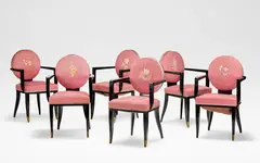 Jean Pascaud, Set of six armchairs, circa 1930, Ebonised wood, pink upholstery with floral embroidery to the backrests, gilt brass caps to the front supports