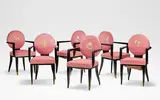 Jean Pascaud, Set of six armchairs, circa 1930, Ebonised wood, pink upholstery with floral embroidery to the backrests, gilt brass caps to the front supports