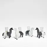 for Venini by Fulvio Bianconi, Lattimo applied glass, each modelled as a horse, each with a clear glass sconce to the back, sold Jun 2025