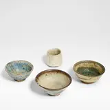 Ewen Henderson, Unusual cut-sided tea bowl, Mixed laminated stoneware clays, in tones of cream, blue and olive green, with running glazes and iron glaze