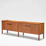 Arne Hovmand-Olsen, for Mogens Kold Mobelfabrik, circa 1960, Teak, the rectangular top over two pairs of cabinet doors, each opening onto shelving and drawers