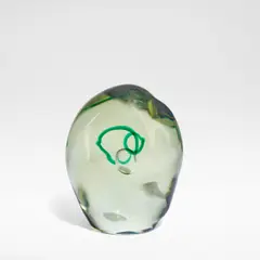 Sculpture by Livio Seguso, circa 1975, Cast glass with a central air bubble, set on either side by a green ring, sold Jun 2025
