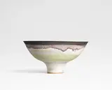 Footed bowl by Lucie Rie, circa 1966, Stoneware, green glaze, bronze running rim, sold Oct 2024