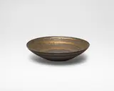 Open bowl, designed for the 50th wedding anniversary of Lord and Lady Chorley, Stanmore, United Kingdom by Lucie Rie, 1975, Stoneware, golden manganese and brown glazes, sold Oct 2024