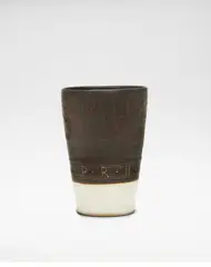 Beaker by Lucie Rie, 1957, Stoneware, manganese and white pitted glazes, sold Oct 2024