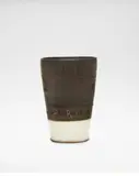Beaker by Lucie Rie, 1957, Stoneware, manganese and white pitted glazes, sold Oct 2024