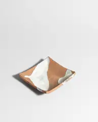 Early dish by Janet Leach, circa 1958, Stoneware, dry brown unglazed body, shiny white glaze with brown speckle, sold Oct 2024