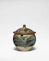 Lidded jampot by Bernard Leach, Stoneware, cream, blue, and brushed iron glazes, sold Oct 2024