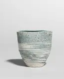 Oval vase by Lucie Rie, circa 1976, Mixed stoneware thrown together to produce an integral blue and white spiral beneath the glaze, sold Apr 2024