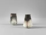 Two small vases by Lucie Rie, circa 1975, Porcelain, cream and light blue glazes with manganese rims, sold Apr 2024