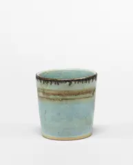 Small beaker by Lucie Rie, circa 1960, Stoneware, light blue glaze with manganese band and rim, sold Apr 2024