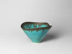 Conical bowl by Lucie Rie, circa 1985, Stoneware, vivid blue glaze with golden manganese lip, sold Apr 2024