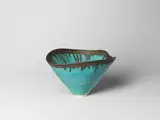 Conical bowl by Lucie Rie, circa 1985, Stoneware, vivid blue glaze with golden manganese lip, sold Apr 2024