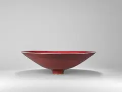 Large open bowl by Rupert Spira, circa 2003, Stoneware, copper red glaze with a mottled lilac flush, sold Apr 2024