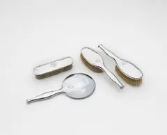 Dressing table set by Omar Ramsden, 1922, Sterling silver, mirrored glass, sold Apr 2024