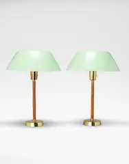 Pair of 'Senator' table lights, model no. 40-025 by Isa Johansson-Pape, circa 1955, Brass, leather, acrylic, painted metal, sold Apr 2024