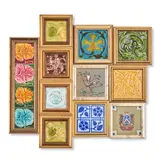 Fourteen Tiles, various makers, including a Maw with raised dragon under green glaze, tile 4 1/4 x 4 1/4, frame 5 1/2 x 5 1/2, four flowers in a common frame, tiles 3 x 3, frame 13 1/2 x 4 1/4, and two Pilkington Art Nouveau floral tiles, 3 x 3, frames 4 3/4 4 3/4 in.