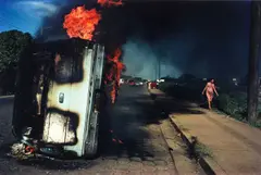Susan Meiselas, Car of Samoza informer burning in Managua, Nicaragua 1978, 1978, Dye transfer print, printed in 1989 on double-weight semi-matte paper