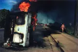 Susan Meiselas, Car of Samoza informer burning in Managua, Nicaragua 1978, 1978, Dye transfer print, printed in 1989 on double-weight semi-matte paper