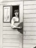 August Sander, Mädchen im Kirmeswagen' (Girl in Fairground Caravan), Cologne 1926/32, 1926, Gelatin silver print, printed 1990 by Gerd Sander on double-weight semi-matte paper, in perfect condition. Blindstamped "Aug. Sander Köln Lindenthal" in the lower left