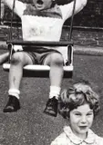 William Klein, Boy on swing + simpering girl', New York 1955, 1955, Gelatin silver print, printed in the 1980s on double-weight semi-matte paper, in excellent condition. Signed