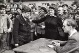 Henri Cartier-Bresson, A Gestapo informer is exposed, Dessau, Germany 1945