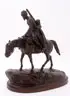 Feliks Khodorovich, A Georgian Soldier on Horseback Moving His Family, Bronze with dark brown patina