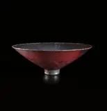 Footed bowl by Gertrud Natzler and Otto Natzler, 1961, Earthenware, dark sang and blue nocturne reduction glaze with crystal formations and iridescence, sold Jun 2015