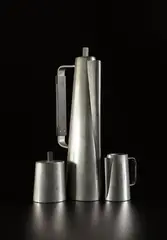 Early coffee set by Paul Evans, circa 1953, Pewter, rosewood, sold Jun 2015