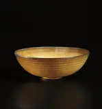 Bowl by Gertrud Natzler and Otto Natzler, circa 1960, Earthenware, yellow and brown glaze with hare's fur pattern, sold Jun 2015