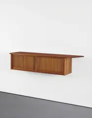 Wall-mounted cabinet by George Nakashima, circa 1975, Walnut, pandanus cloth, sold Jun 2015