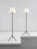 Jacques Adnet, Pair of floor lamps, circa 1950, Leather, brass, steel, fabric shades