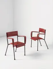 Pair of armchairs by Jacques Adnet, 1950s, Leather, painted steel, brass, rubber, sold Jun 2015