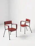 Jacques Adnet, Pair of armchairs, 1950s, Leather, painted steel, brass, rubber