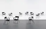 Jacques Adnet, Set of ten dining armchairs, 1950s, Leather, steel, brass