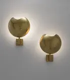 Pair of wall lights by Paavo Tynell, 1950s, Perforated and partially painted brass, sold Jun 2015