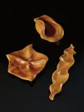 Russel Wright, Three bowls from the "Oceana" series, including the "Centerpiece Bowl," "Starfish Relish," and "Wave Salad Bowl", circa 1940, Laminated and carved hazelwood