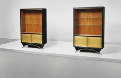 Eugène Printz, Pair of bookcases, circa 1932, Ebonized wood, walnut-veneered wood, bronze, brass, glass