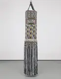 Jeffrey Gibson (Choctaw & Cherokee), Hit That Perfect Beat, 2014, found punching bag, re-purposed wool blanket, glass beads, steel studs, tin jingles, nylon fringe, artificial sinew, steel chains