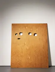Cady Noland, Enquirer Page with Eyes Cut Out Template, 1991, plywood