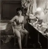 Stripper, Miss Sata Lyte, in her dressing room with glasses Atlantic City, N.J. by Diane Arbus, 1962, Gelatin silver print, printed 1963-1965, sold Apr 2014