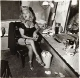 Burlesque Comedienne in her dressing room, Atlantic City, N.J. by Diane Arbus, 1963, Gelatin silver print, printed later by Neil Selkirk, sold Apr 2014